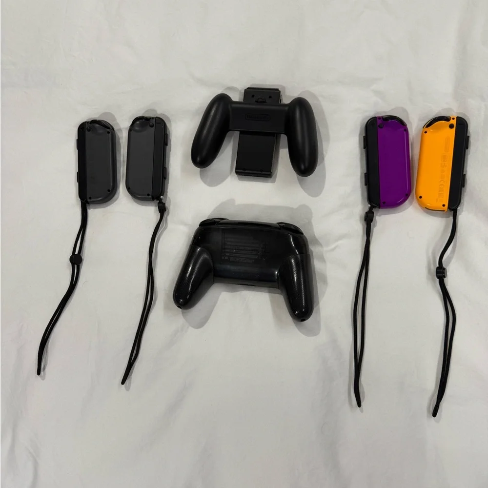 Nintendo Switch with Gray, Purple, and Orange Joy-Con Controllers